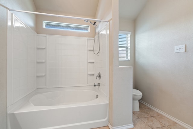 bathroom featuring toilet, shower / tub combination, and tile patterned floors