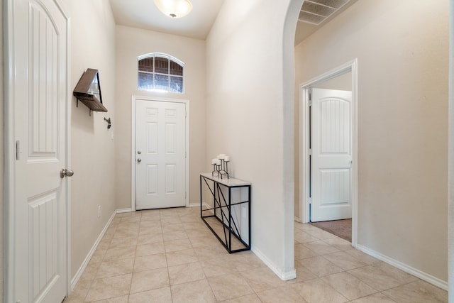 entryway with light tile patterned floors