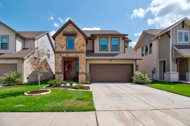 view of front of property with a garage and a front lawn