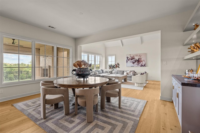 dining space featuring light wood-type flooring