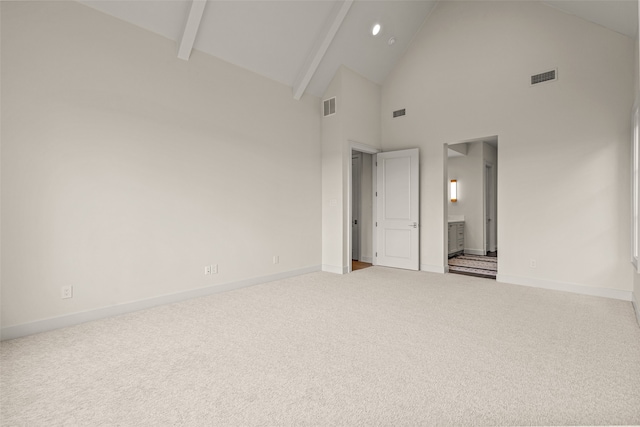 carpeted spare room with high vaulted ceiling and beamed ceiling