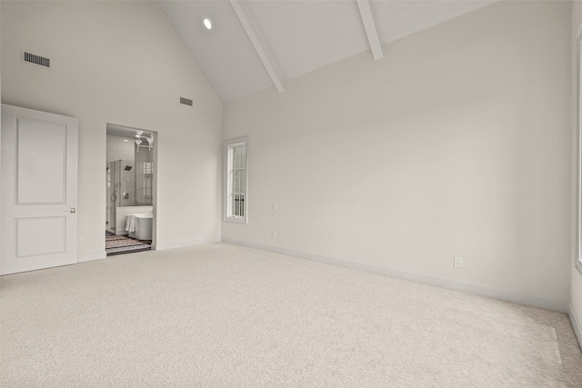 carpeted empty room featuring high vaulted ceiling and beamed ceiling