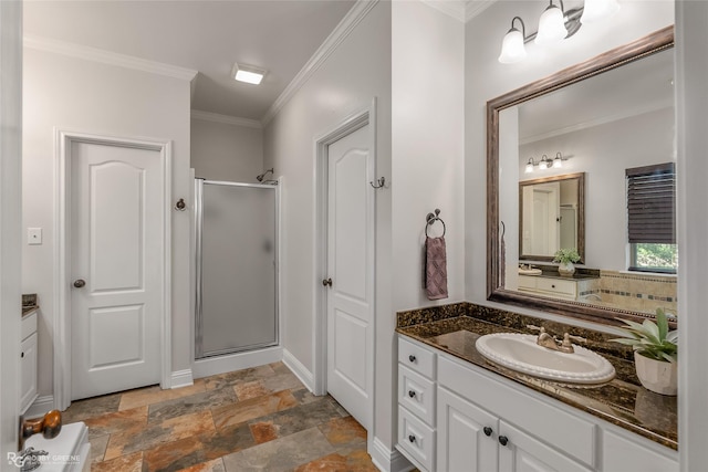 bathroom featuring vanity, ornamental molding, and a shower with door