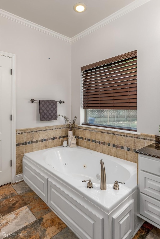 bathroom with crown molding, tile walls, vanity, and a bathtub