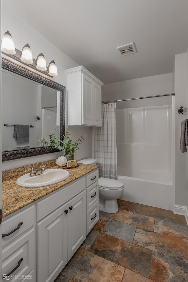 full bathroom with vanity, toilet, and shower / tub combo