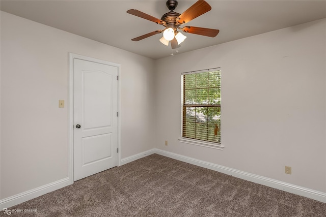 empty room with ceiling fan and carpet