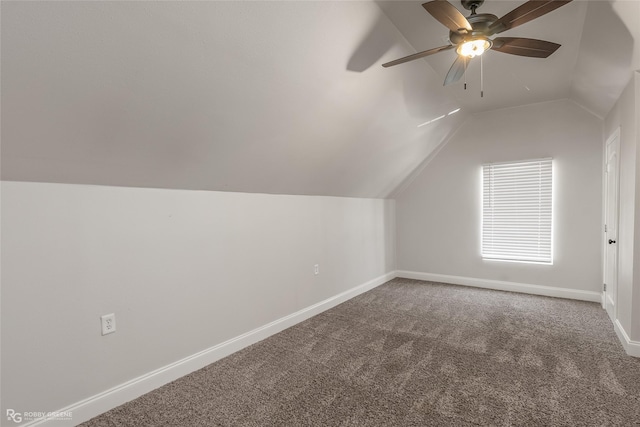 additional living space featuring carpet, lofted ceiling, and ceiling fan