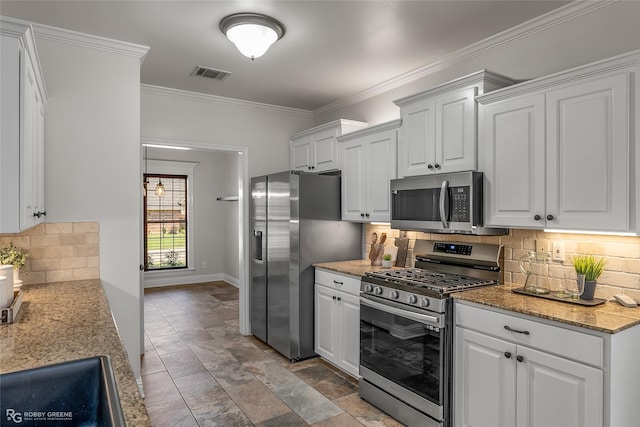 kitchen with white cabinetry, ornamental molding, and appliances with stainless steel finishes