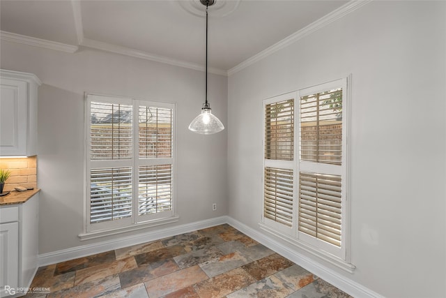 unfurnished dining area featuring ornamental molding