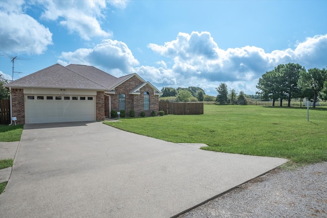 view of front facade with a garage and a front yard