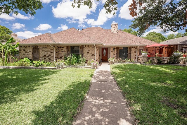 ranch-style house with a front lawn