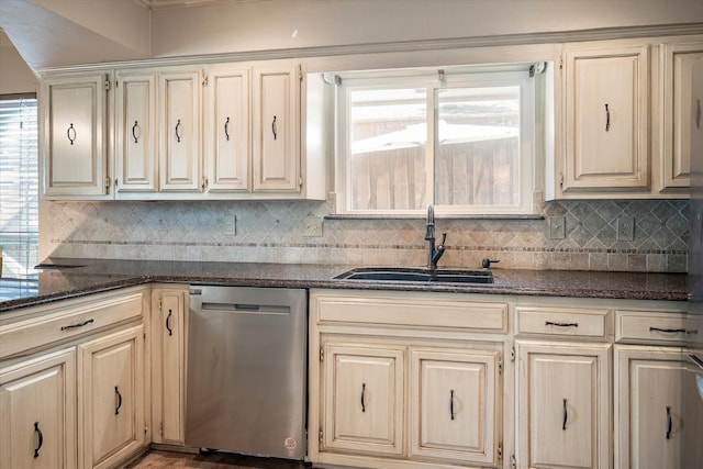 kitchen featuring a wealth of natural light, sink, dishwasher, and tasteful backsplash