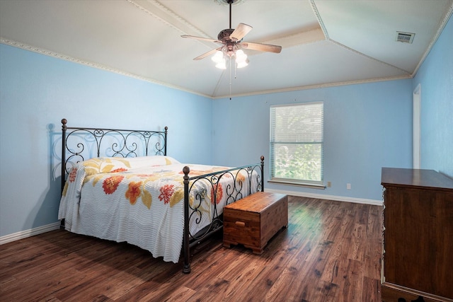 bedroom featuring dark wood-type flooring, vaulted ceiling, ornamental molding, and ceiling fan