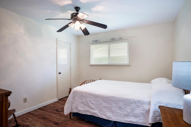 bedroom featuring dark hardwood / wood-style flooring and ceiling fan