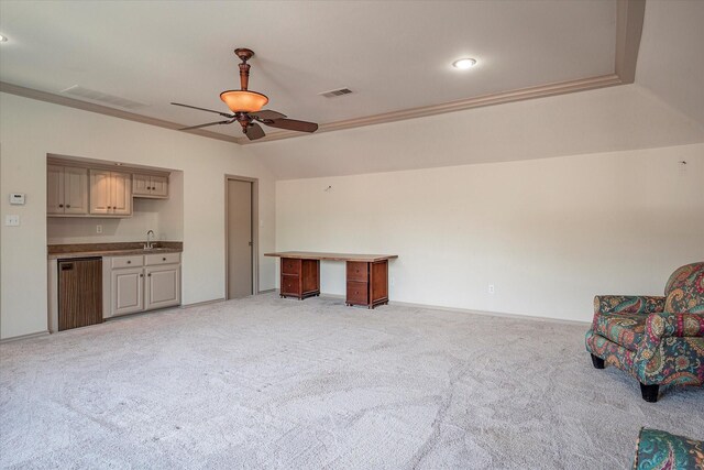 living room featuring ornamental molding, sink, light carpet, and ceiling fan