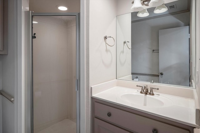 bathroom with vanity and an enclosed shower