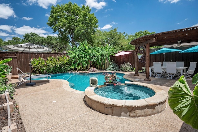 view of pool with an in ground hot tub, ceiling fan, and a patio