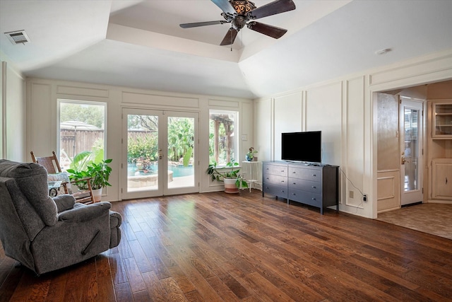 living room featuring french doors, lofted ceiling, dark hardwood / wood-style floors, and a wealth of natural light