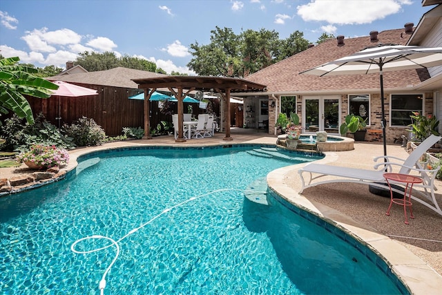 view of pool featuring an in ground hot tub, a pergola, and a patio