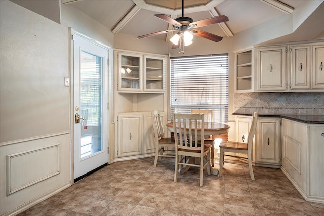 dining area featuring ceiling fan, beamed ceiling, a healthy amount of sunlight, and light tile patterned floors