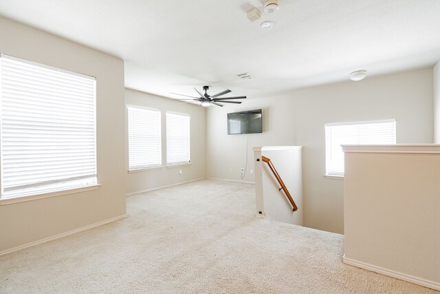 carpeted empty room with ceiling fan