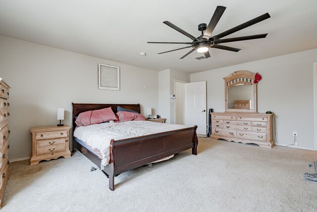 bedroom featuring light carpet and ceiling fan