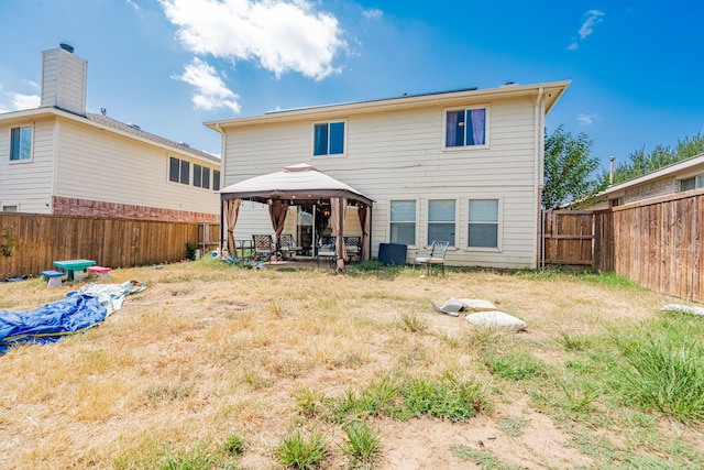 rear view of property with a gazebo