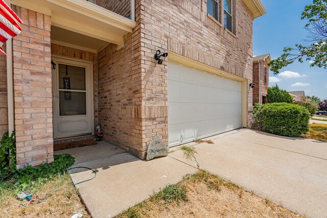 property entrance with a garage