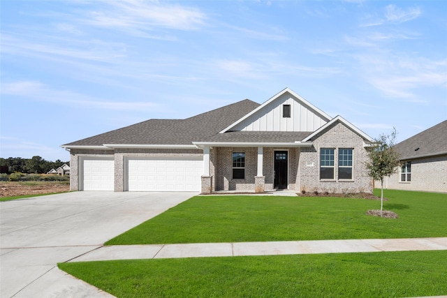 view of front of house with a front yard and a garage