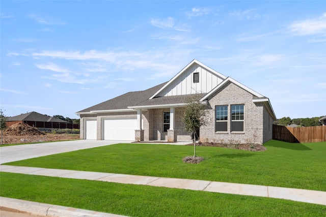 craftsman house featuring a garage and a front lawn