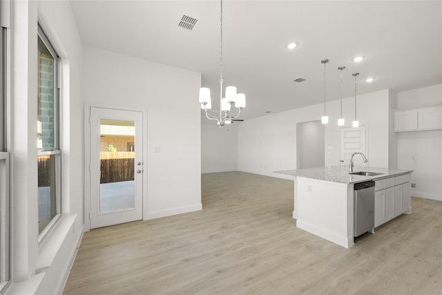 kitchen with sink, dishwasher, a kitchen island with sink, white cabinetry, and decorative light fixtures