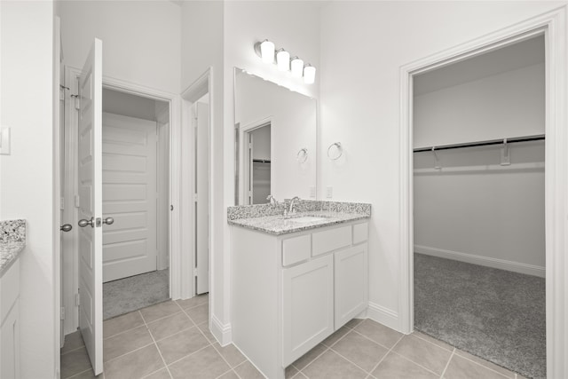 bathroom featuring vanity and tile patterned flooring