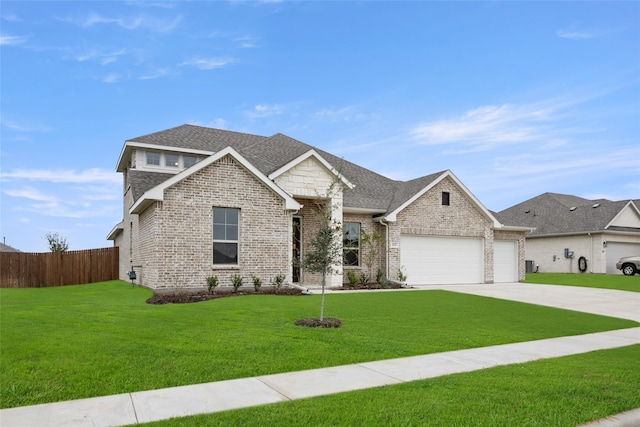 view of front of house with a front yard, an attached garage, brick siding, and concrete driveway