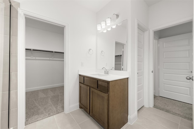 bathroom with tile patterned floors and vanity