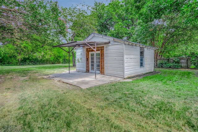 view of outbuilding with a lawn