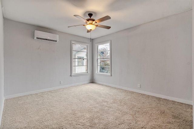 carpeted empty room featuring ceiling fan and a wall unit AC