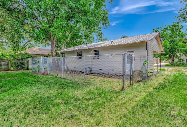 back of house with a yard