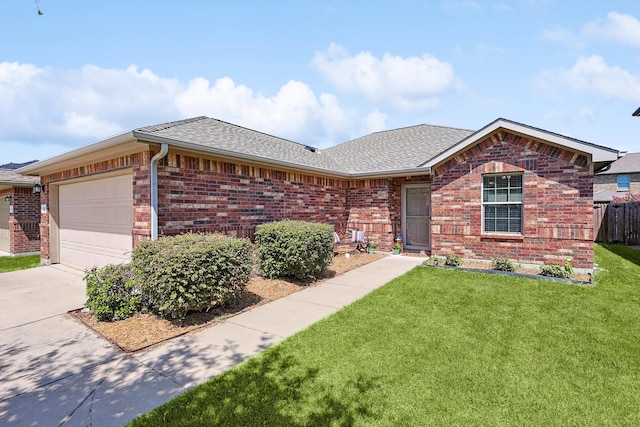 ranch-style home with a garage and a front yard