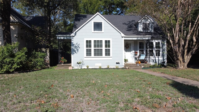 new england style home featuring a front yard