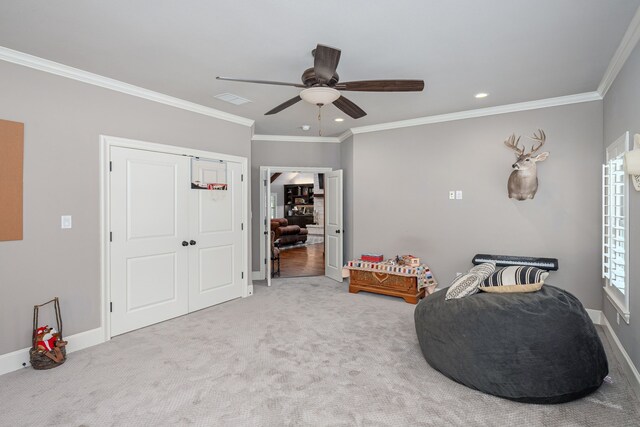 sitting room featuring crown molding, carpet floors, and ceiling fan