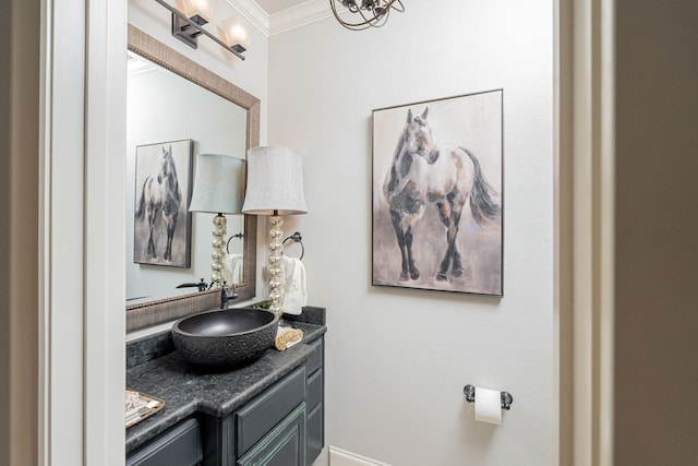 bathroom with vanity and ornamental molding