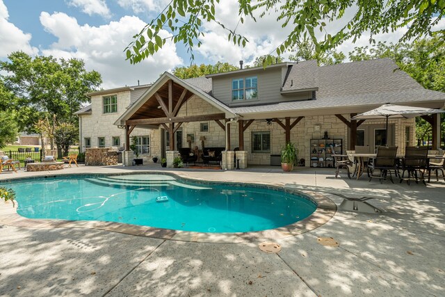 view of swimming pool featuring a patio area