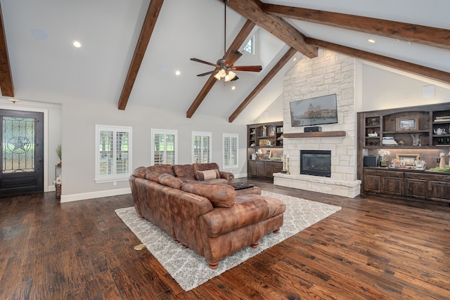 living room with a fireplace, dark wood-type flooring, ceiling fan, and high vaulted ceiling