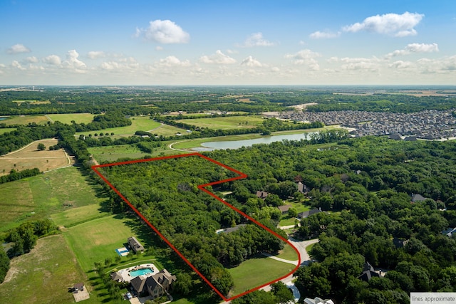 birds eye view of property featuring a water view and a rural view