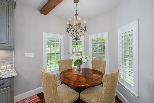 dining room featuring beamed ceiling, a notable chandelier, and hardwood / wood-style floors