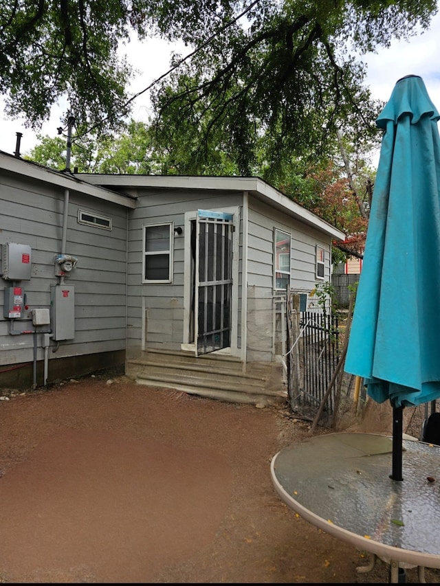 back of property featuring a patio area