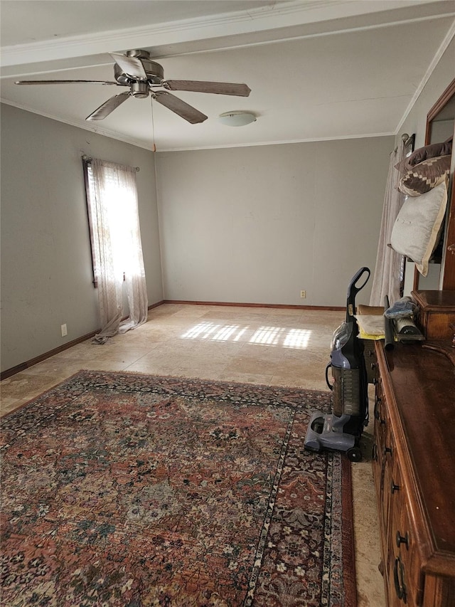 unfurnished room with ceiling fan and ornamental molding