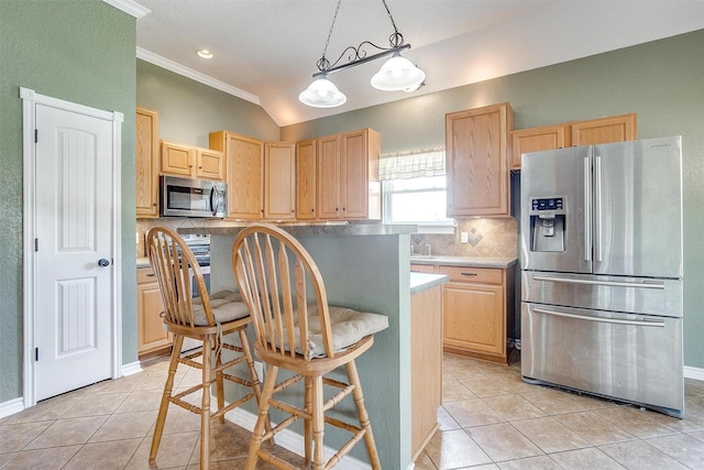 kitchen featuring appliances with stainless steel finishes, pendant lighting, light brown cabinetry, decorative backsplash, and light tile patterned floors