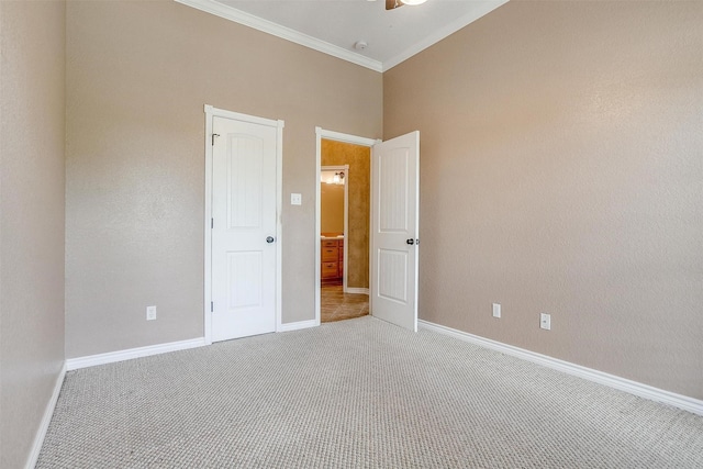 unfurnished room featuring crown molding, carpet floors, and ceiling fan