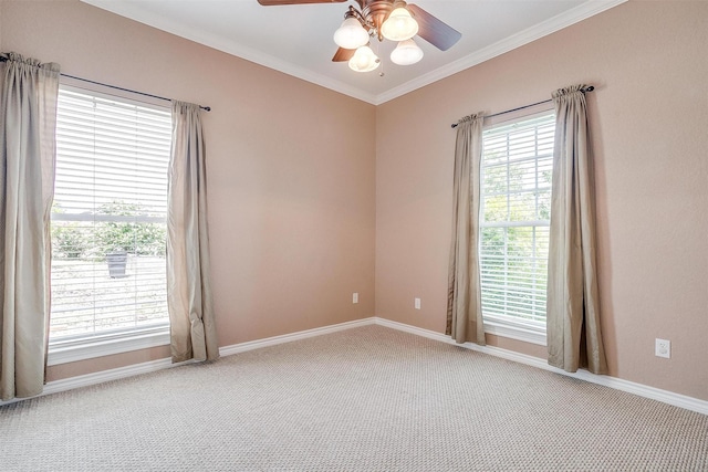 unfurnished room with light colored carpet, ornamental molding, and ceiling fan